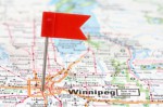 A map of Winnipeg, Manitoba, Canada with a red flag pin placed over the city