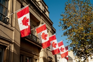 Canadian flags hanging from a balcony