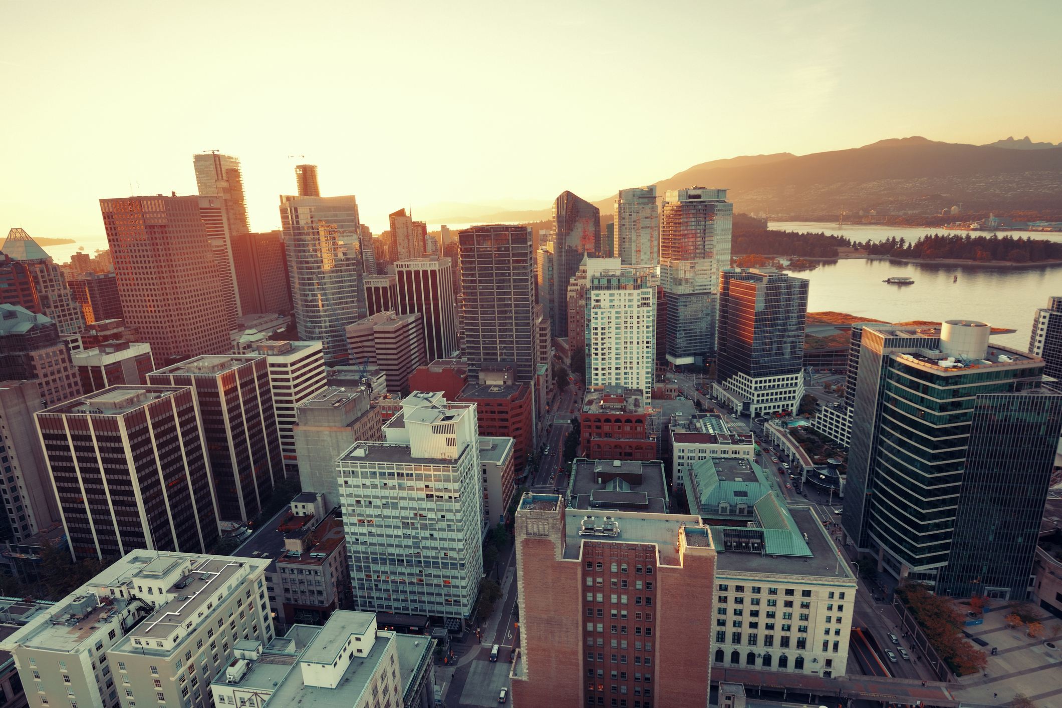 Vancouver rooftop view with urban architectures at sunset.