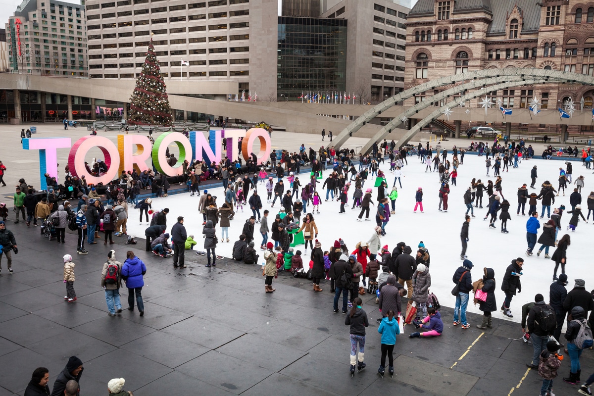 Toronto ice rink with 3d colorful text and many people