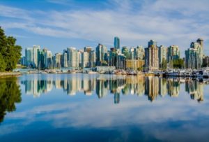 View of Vancouver skyline reflecting on water.