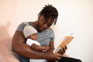 Dad and baby reading a book