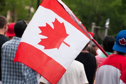 People holding Canadian flag
