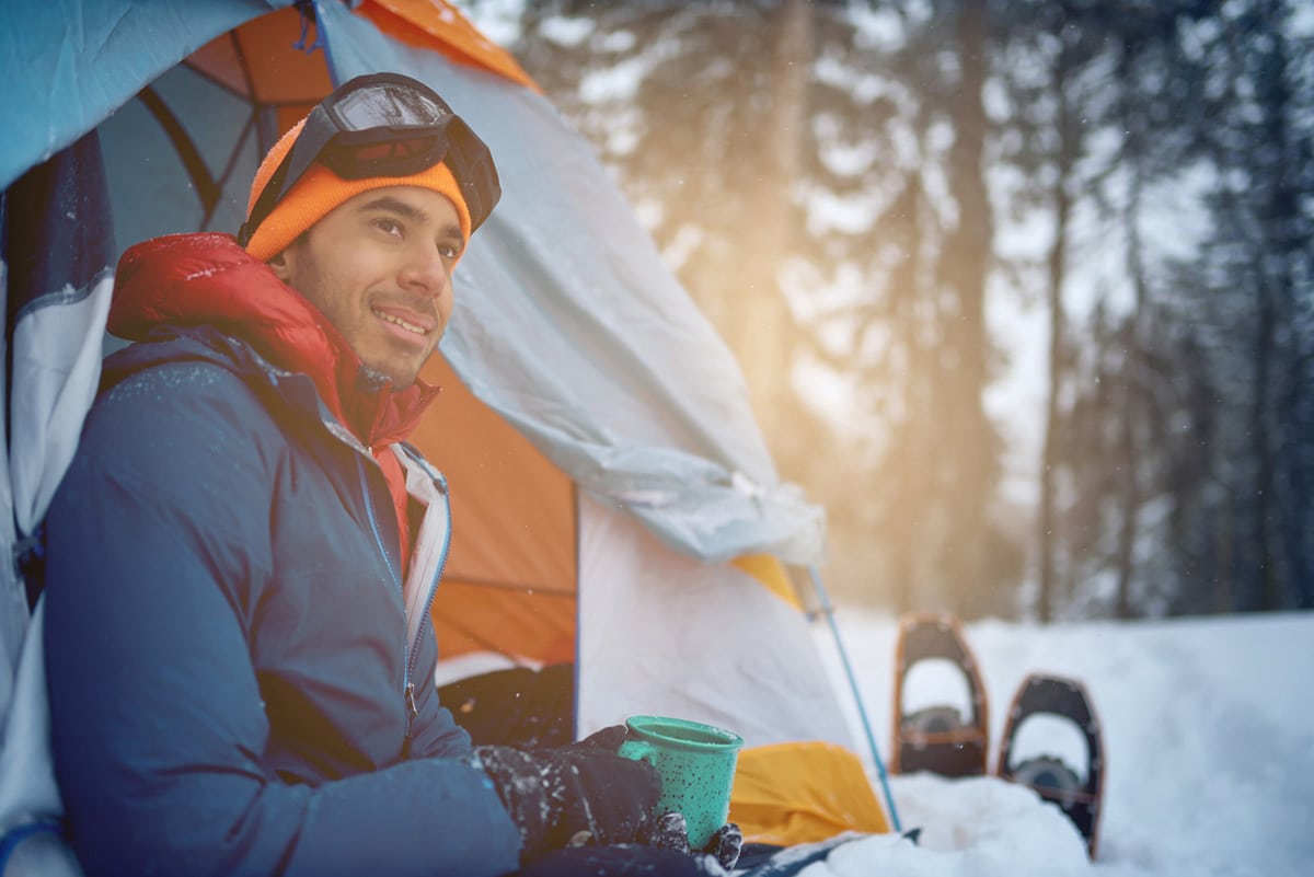 Man winter camping in Canada