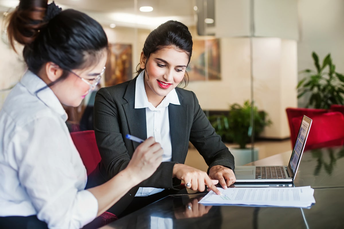 A lawyer and client doing paperwork