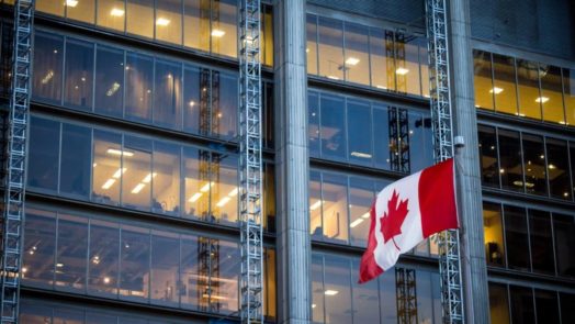Business building and a Canadian flag