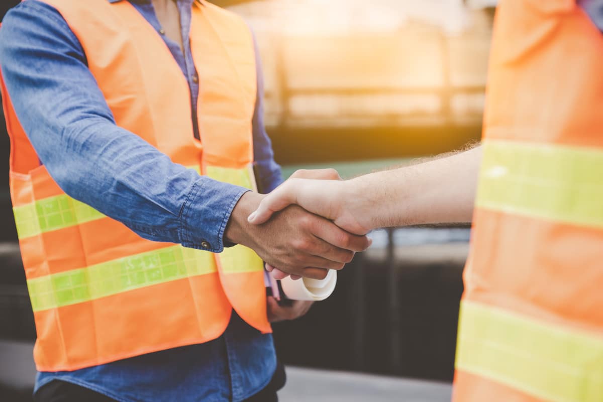 Workers shaking hands