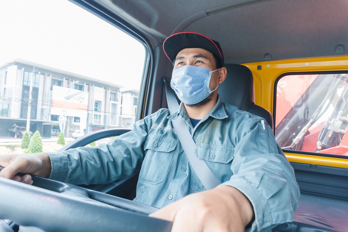 Truck driver wearing COVID mask