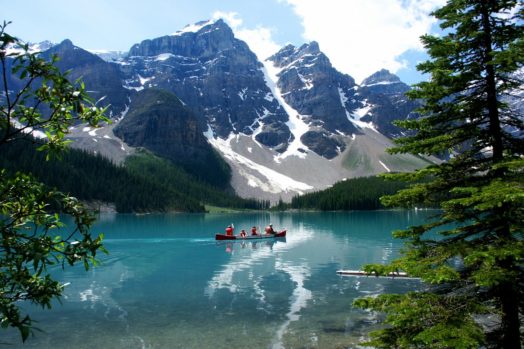 Canoe on Lake Moraine with glaciers in the Rocky