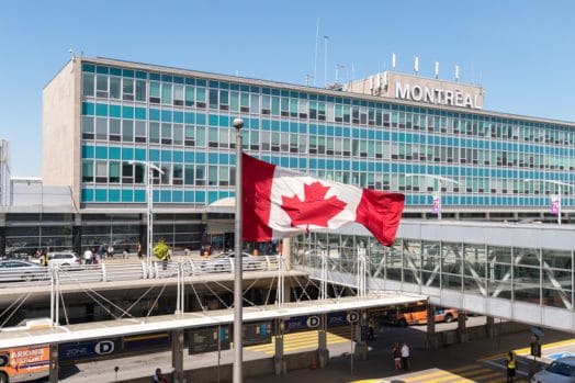 Canadian flag waving outside Montreal airport