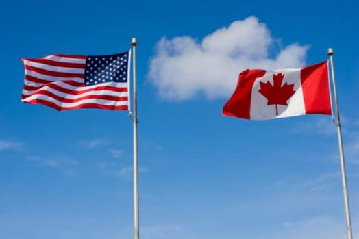 Canada U.S. flags side by side
