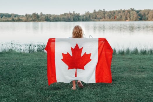 Girl holding Canada flag.