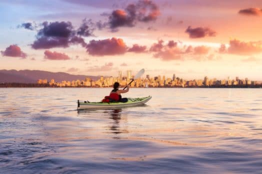 Woman kayaking in Vancouver's harbour