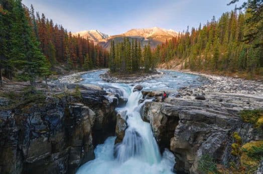 A waterfall with two streams converging