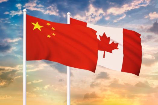 Chinese flag and Canadian flag waving
