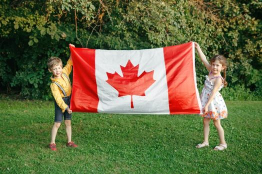 Kids holding Canadian flag