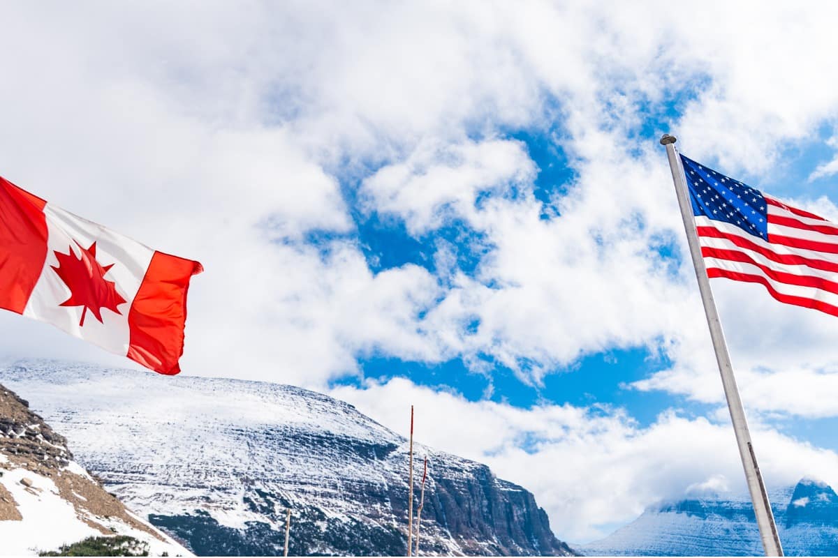US and Canadian flags in Logan Pass (Glacier National Park, Montana, USA)