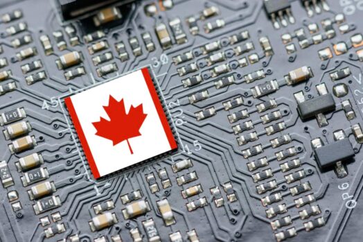 A computer motherboard with the Canadian flag above the processor chip
