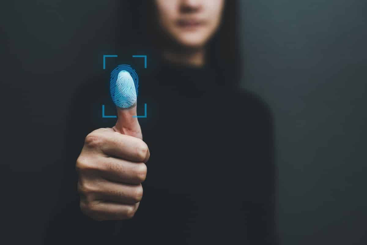 Touch screen, fingerprint scanner, biometric identity of a woman's hand in a blurred background