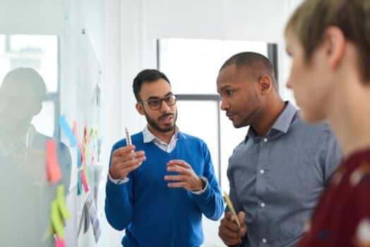 People working on whiteboard