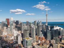 An overview of the Toronto skyline. Ontario has one of the highest proportion of newcomers in its workforce—see how you can join and potentially immigrate to Canada's most populous province.