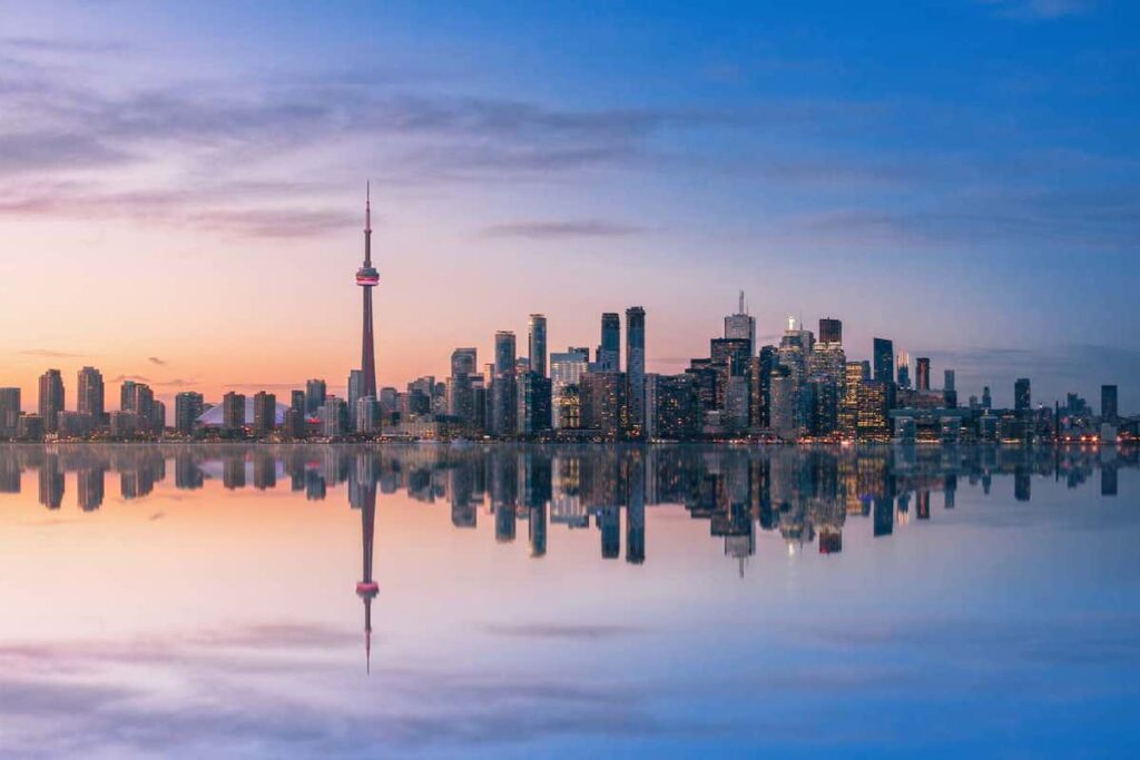 A view of the Toronto skyline at sunrise.