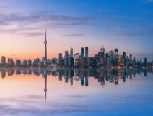 A view of the Toronto skyline at sunrise.