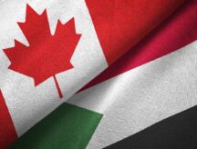 A Canadian and Sudanese flag together.