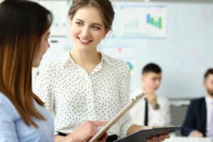 Group of millennial people hold in arms financial papers solve and discuss problem.