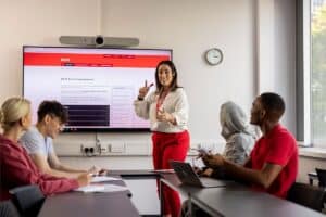 A teacher and her students preparing for the IELTS.