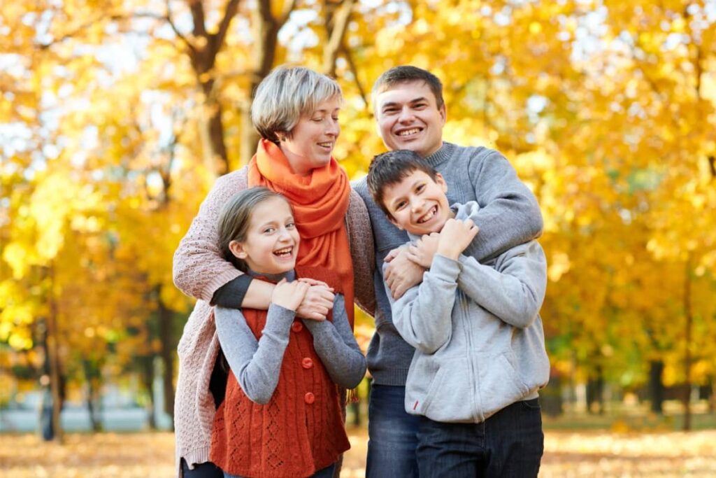Children and parents posing, smiling, playing and having fun.
