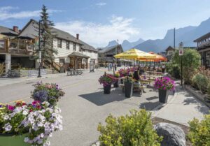 People dine outdoors on a closed downtown street in Canmore Alberta