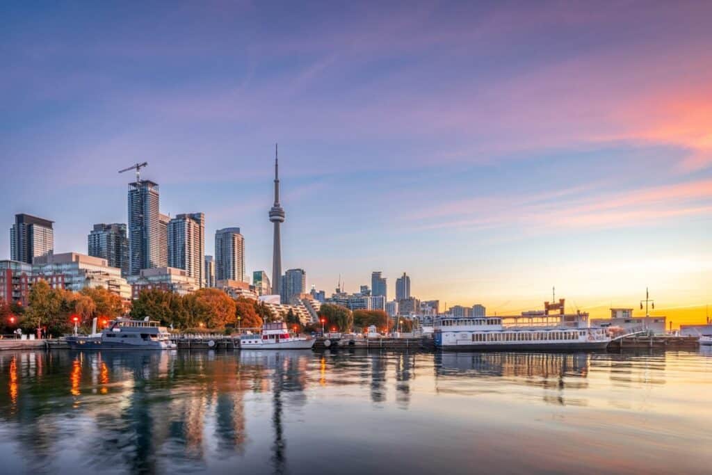 A view of the Toronto skyline from the lake, on a clear summer sunset