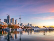 A view of the Toronto skyline from the lake, on a clear summer sunset