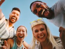 Four cheerful multi-ethnic friends