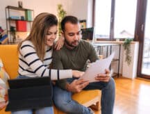 happy couple discussing stocks