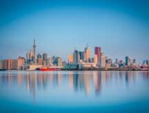 Skyline of Toronto over Ontario Lake at sunrise