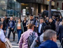 Foreign workers milling down Toronto's Bay Street