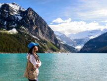 Female hiker enjoying the beautiful view of Lake Louise Banff National Park, Canada