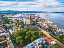An aerial view of Quebec City and Quebec City's Old Port on a semi-cloudy day.