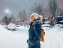 A woman stares at snow in Toronto