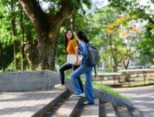 two graduate students walking on campus