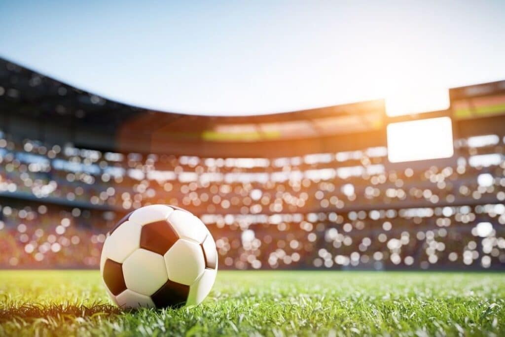 A low angle view of a soccer ball in a stadium.