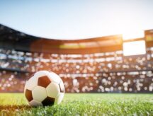A low angle view of a soccer ball in a stadium.