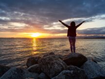Woman stares at the sunset in British Columbia