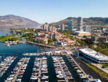 Drone aerial view of the marina yacht club and waterfront of the city of Kelowna, British Columbia, Canada, located in the Okanagan Valley.