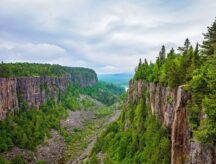 Scenic view overlooking Ouimet Canyon in Ontario, Canada on a cloudy day.