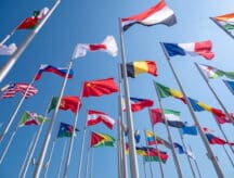 An array of flags blowing in the wind.