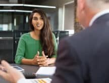 Lady in green dress being interviewed