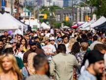 A crowd of people attending a street festival in Toronto.